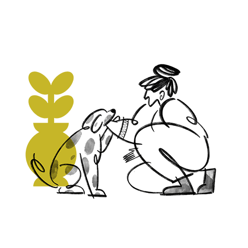 women petting a dog with a plant in the background