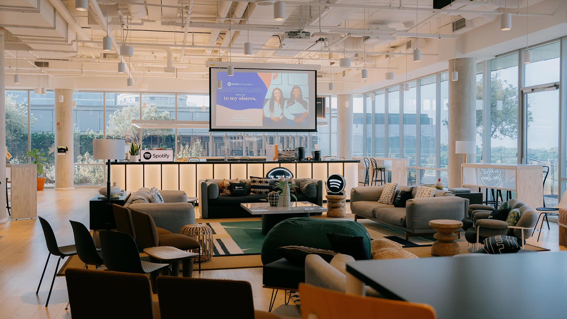 Event Spaces section with a lounge and a presentation screen